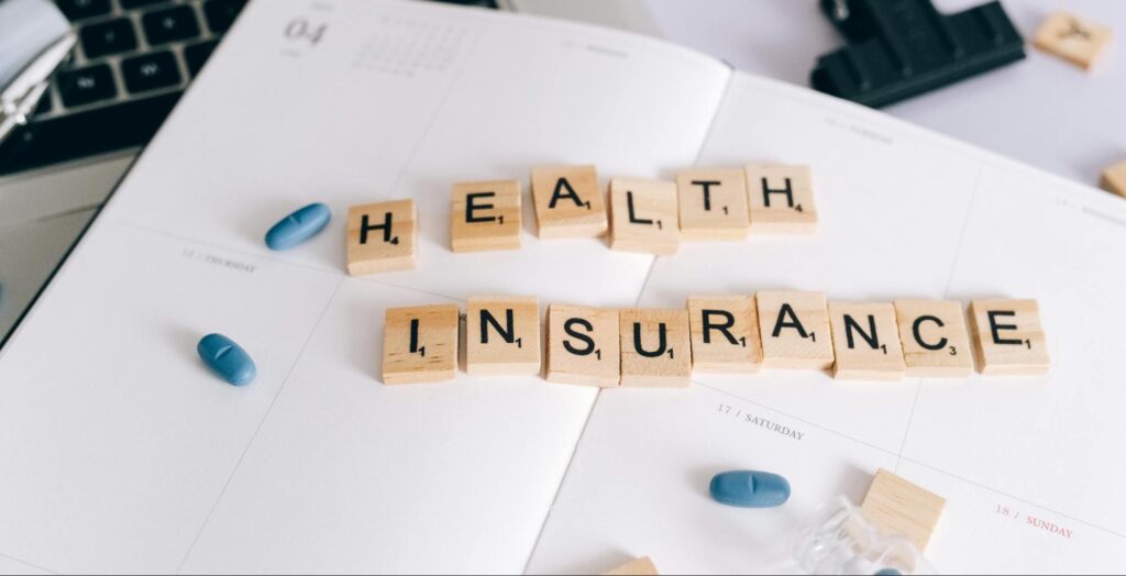 image of letters on a paper spelling health insurance