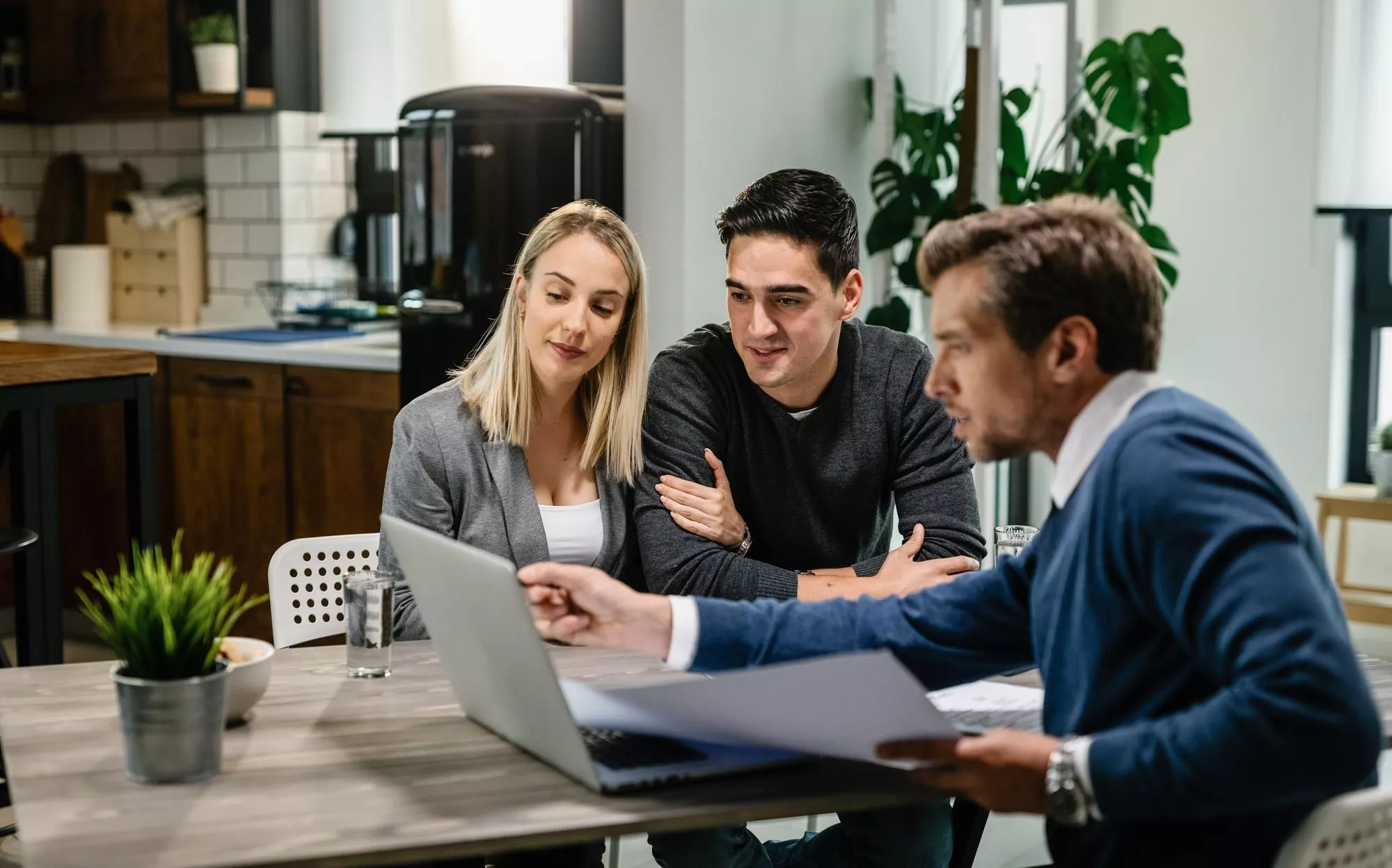 Image of a strata manager talking to his clients