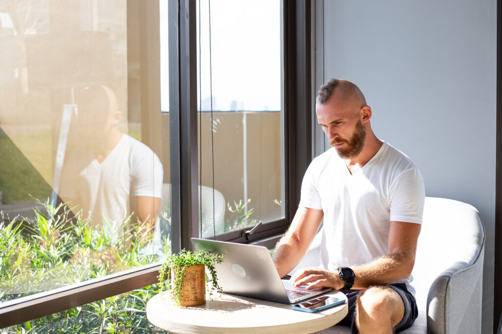 image of a remote worker working from his balcony