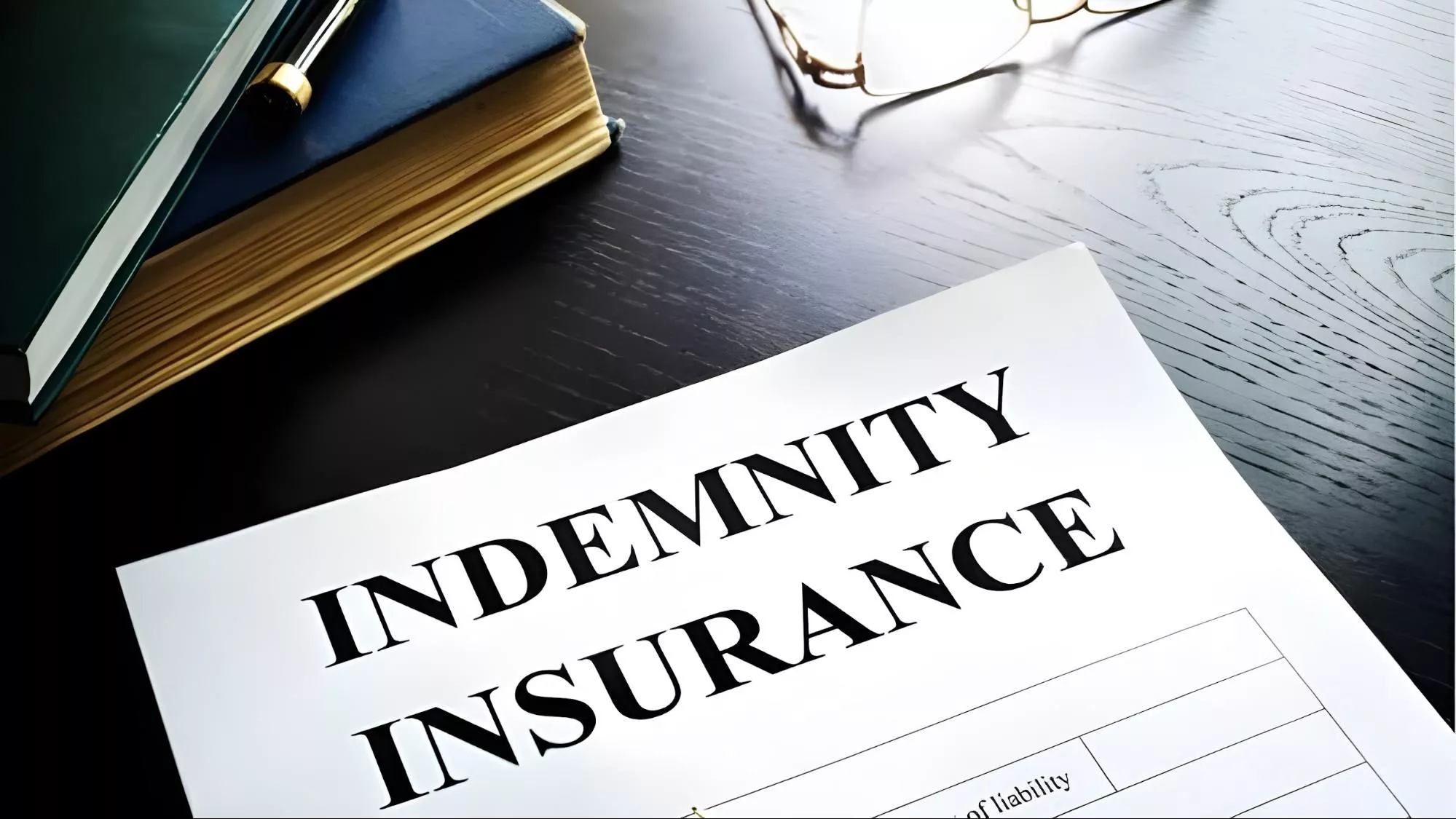 image of a piece of paper on a table with the phrase "indemnity insurance" on it | Cost of Professional Indemnity Insurance | HMD Insurance
