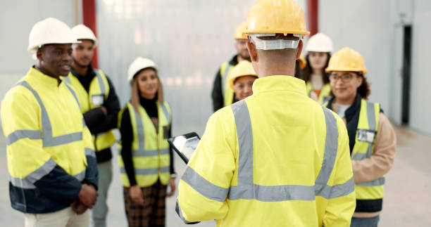 Construction, teamwork and people in meeting for planning, brainstorming and discussion in building. Architecture, engineering and men and women for inspection, property development and project