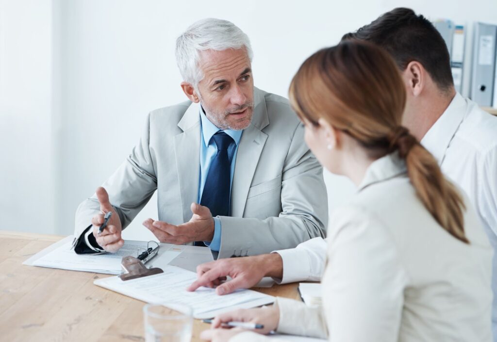 adults talking about Insurance Terminology